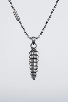 A sleek Scandinavian-style necklace featuring minimalist design and Nordic symbols.