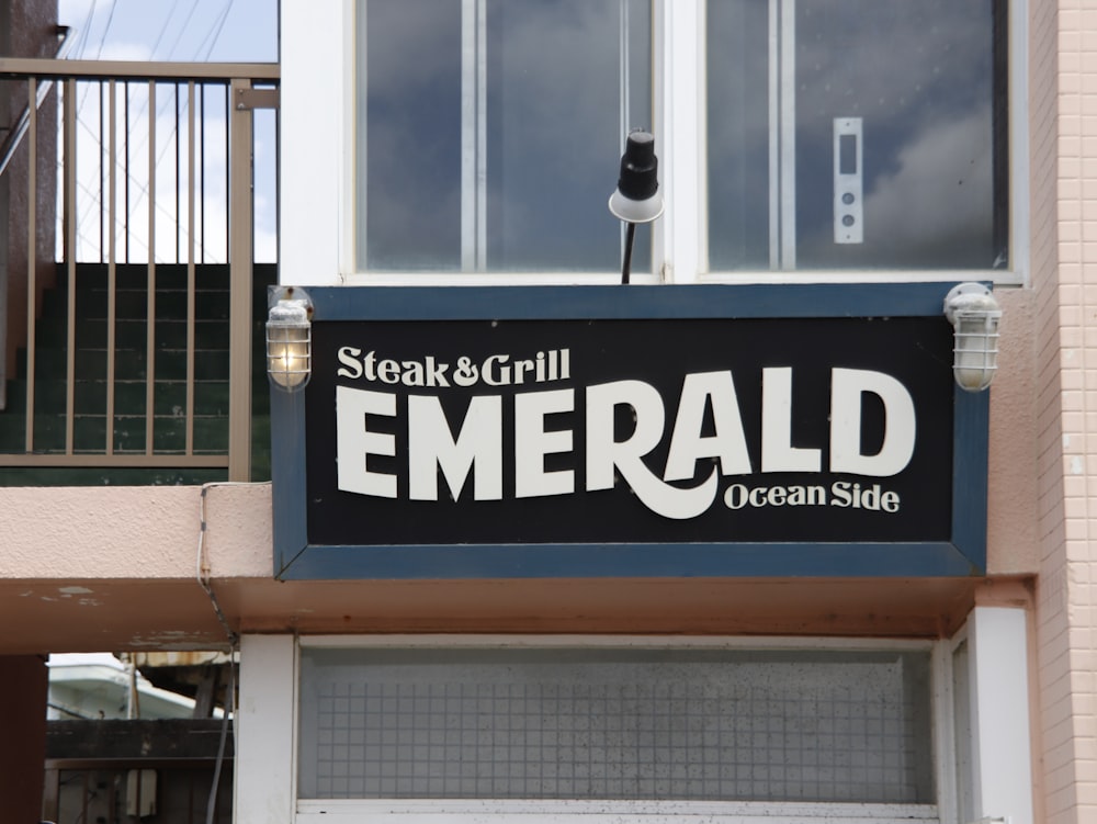 a sign on the side of a building advertising a seafood restaurant