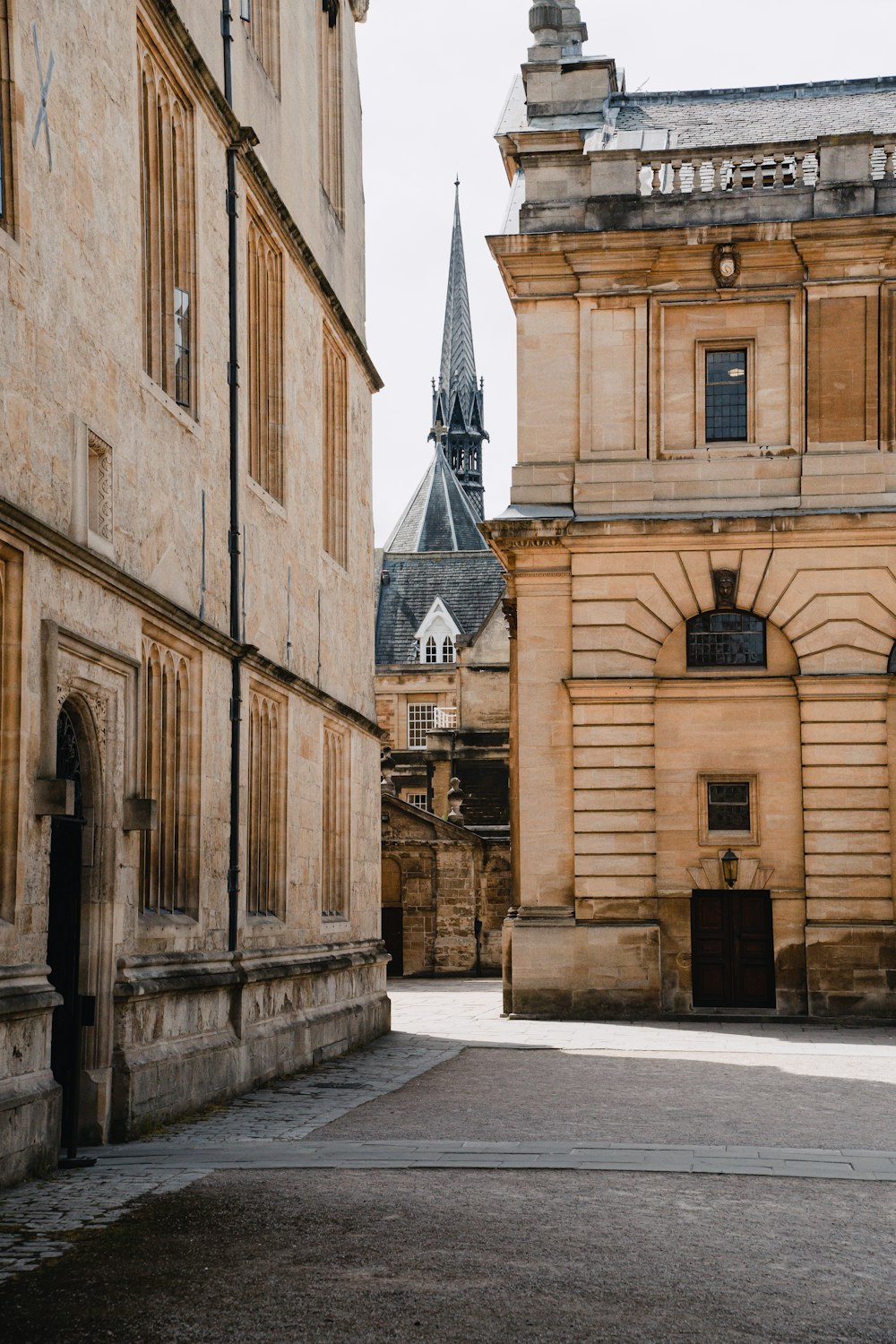 an old building with a clock tower in the background