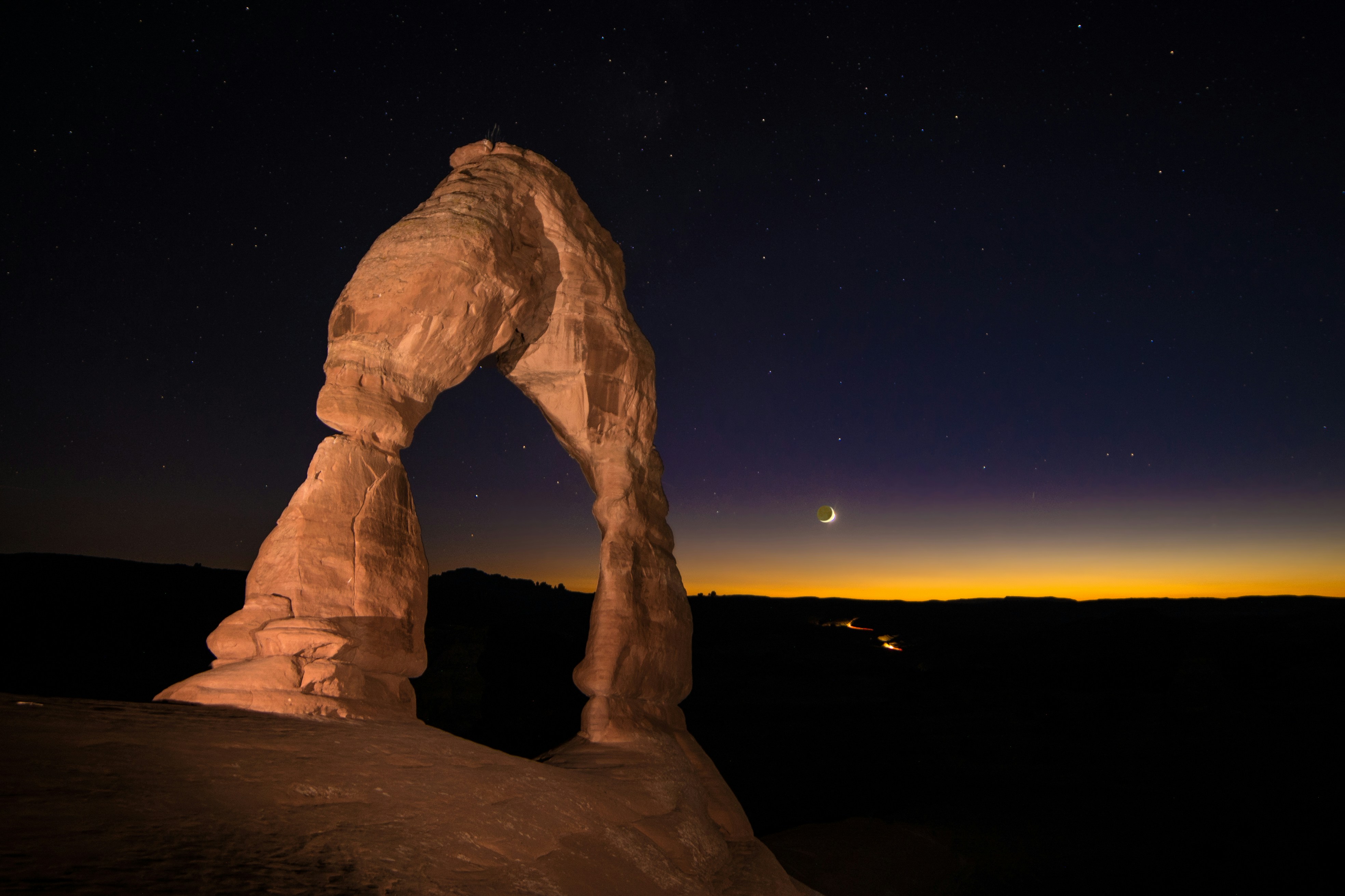 a rock formation in the middle of a night sky