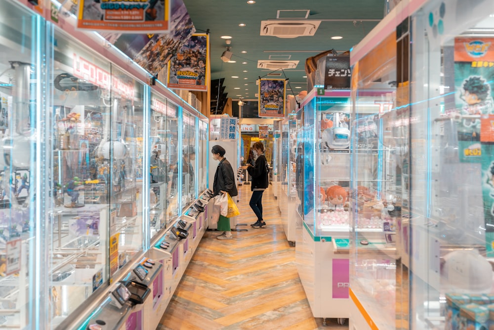 a couple of people standing inside of a store