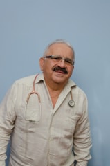 a man with a stethoscope on his neck