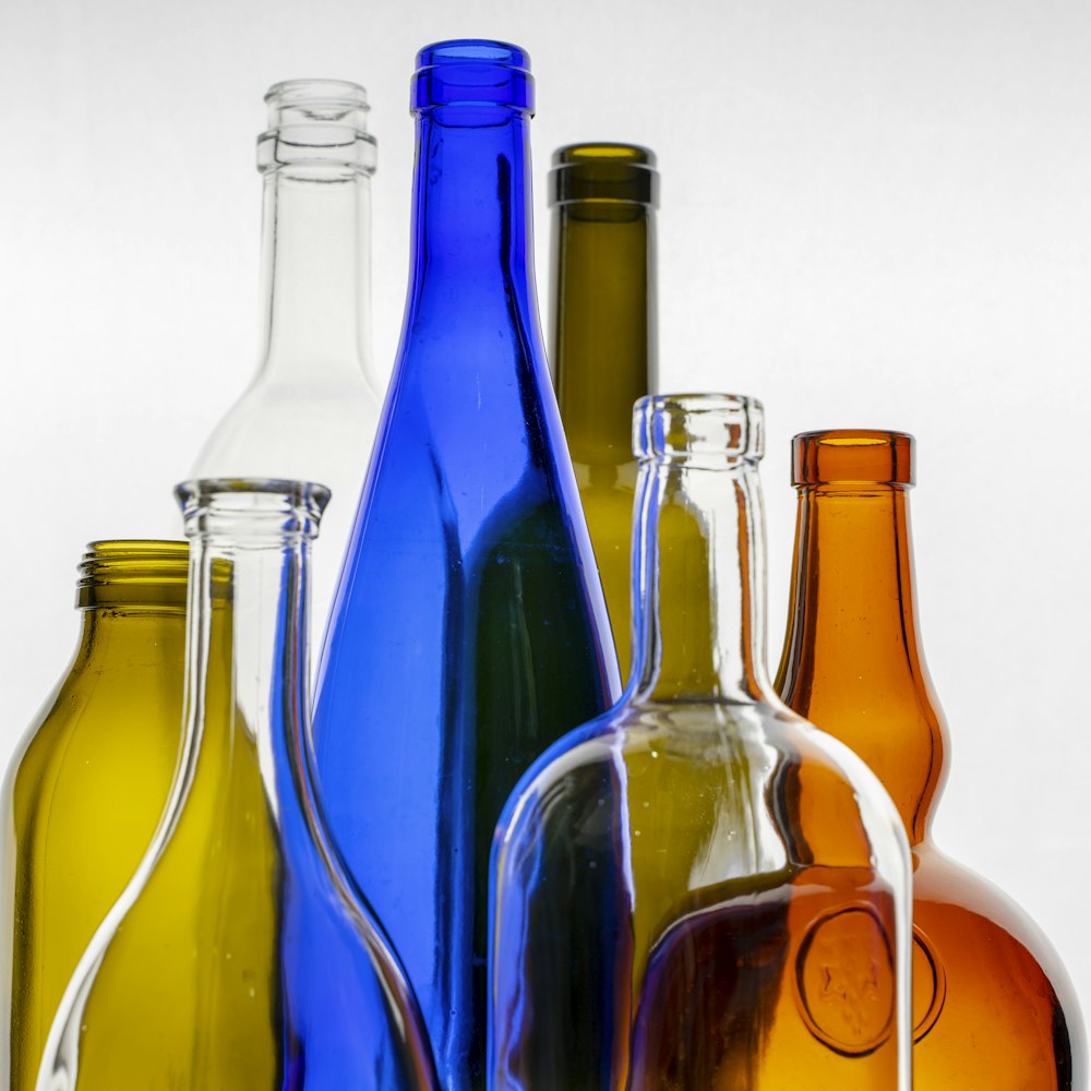 a group of glass bottles sitting next to each other
