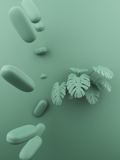 a green background with some plants and rocks