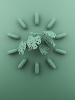 a bunch of green pills with a plant in the middle