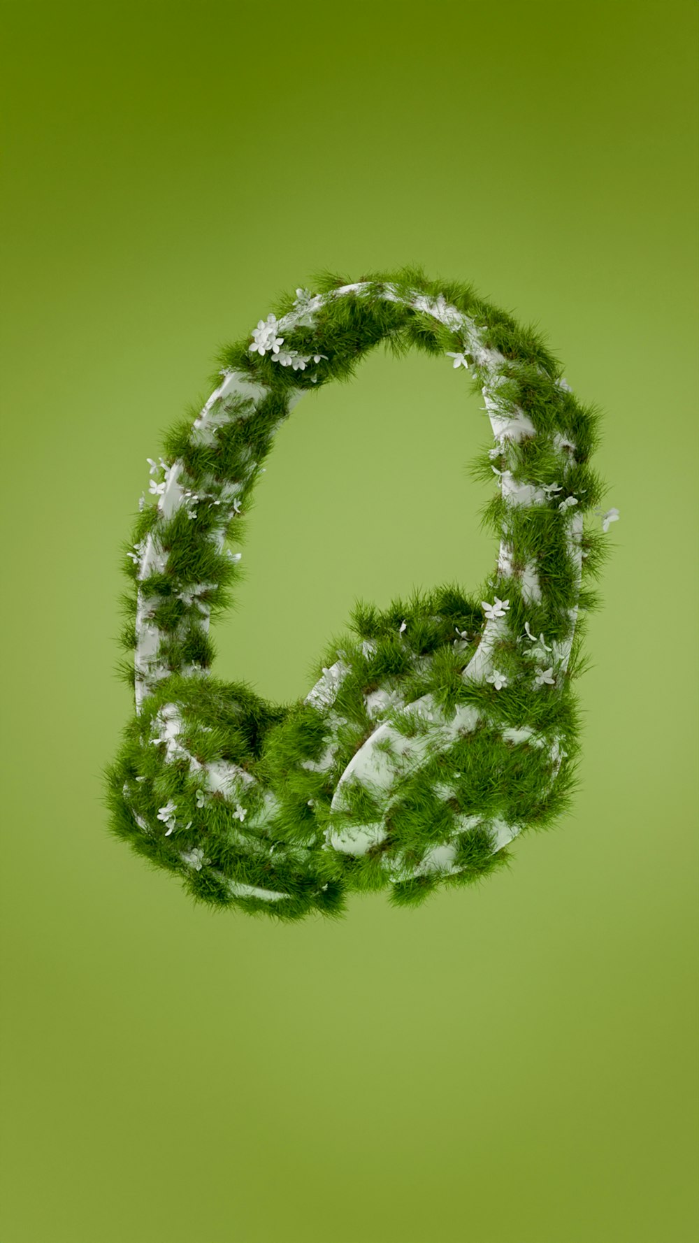 a letter made out of grass on a green background