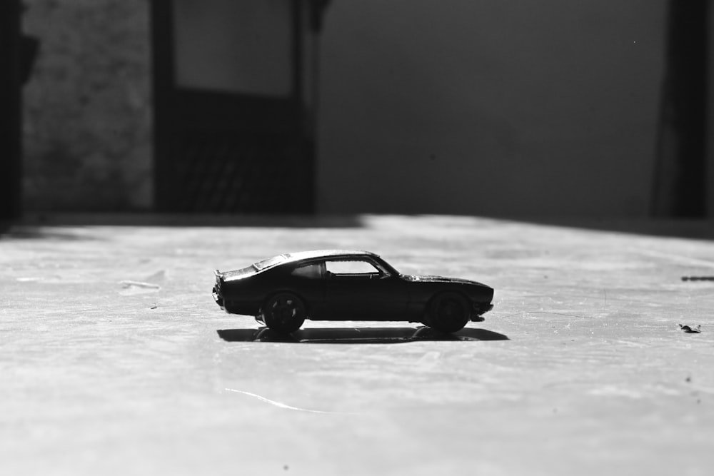 a toy car sitting on top of a table