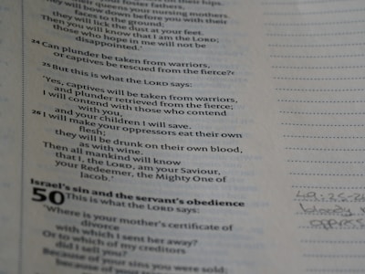 The image displays a close-up view of a page from a book containing text. The content includes numbered biblical references and specific verses centered around themes of conflict and divine intervention. There is also a handwritten note in the margin.