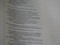 A close-up view of a page from a book, displaying text with a style consistent with biblical scripture. The text is in a clear, serif font, organized into numbered sections with verses aligned on the left. Dotted lines fill the right side of the page, likely intended for notes or comments.