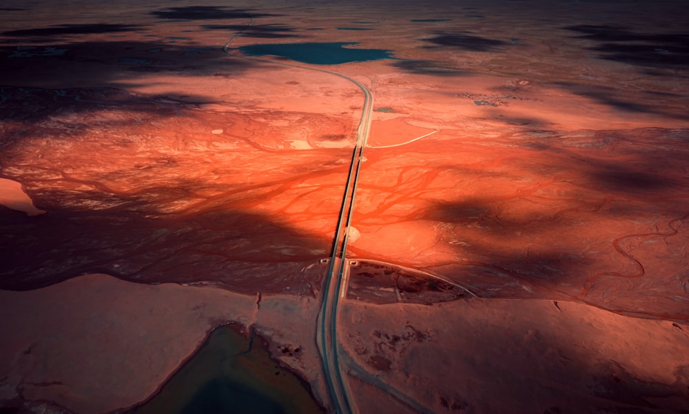 an aerial view of a road in the desert