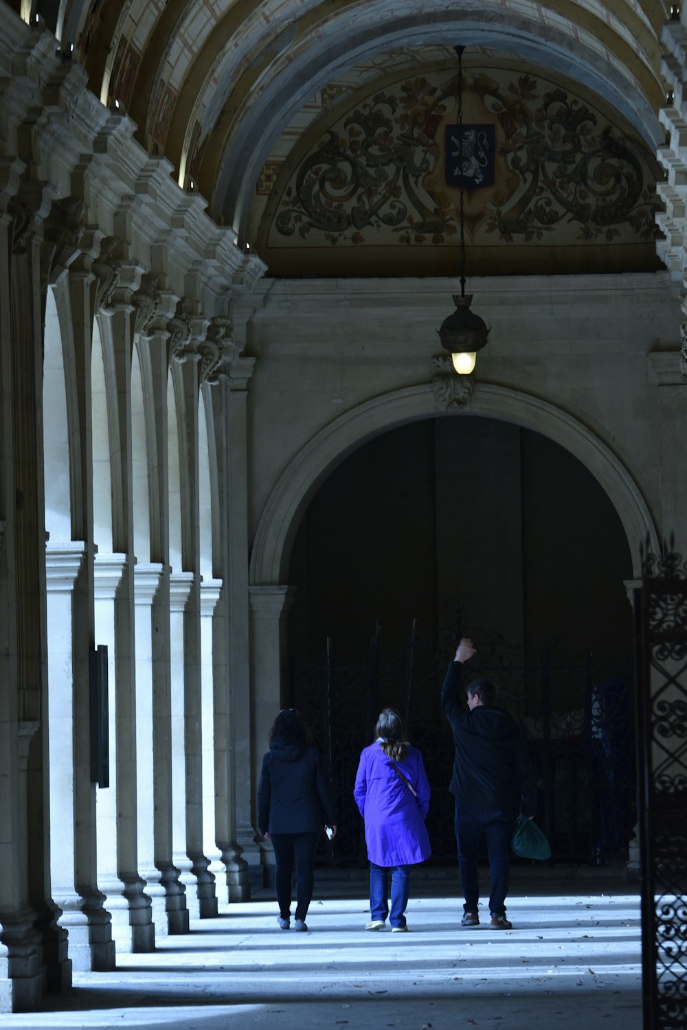 a couple of people that are standing in a building