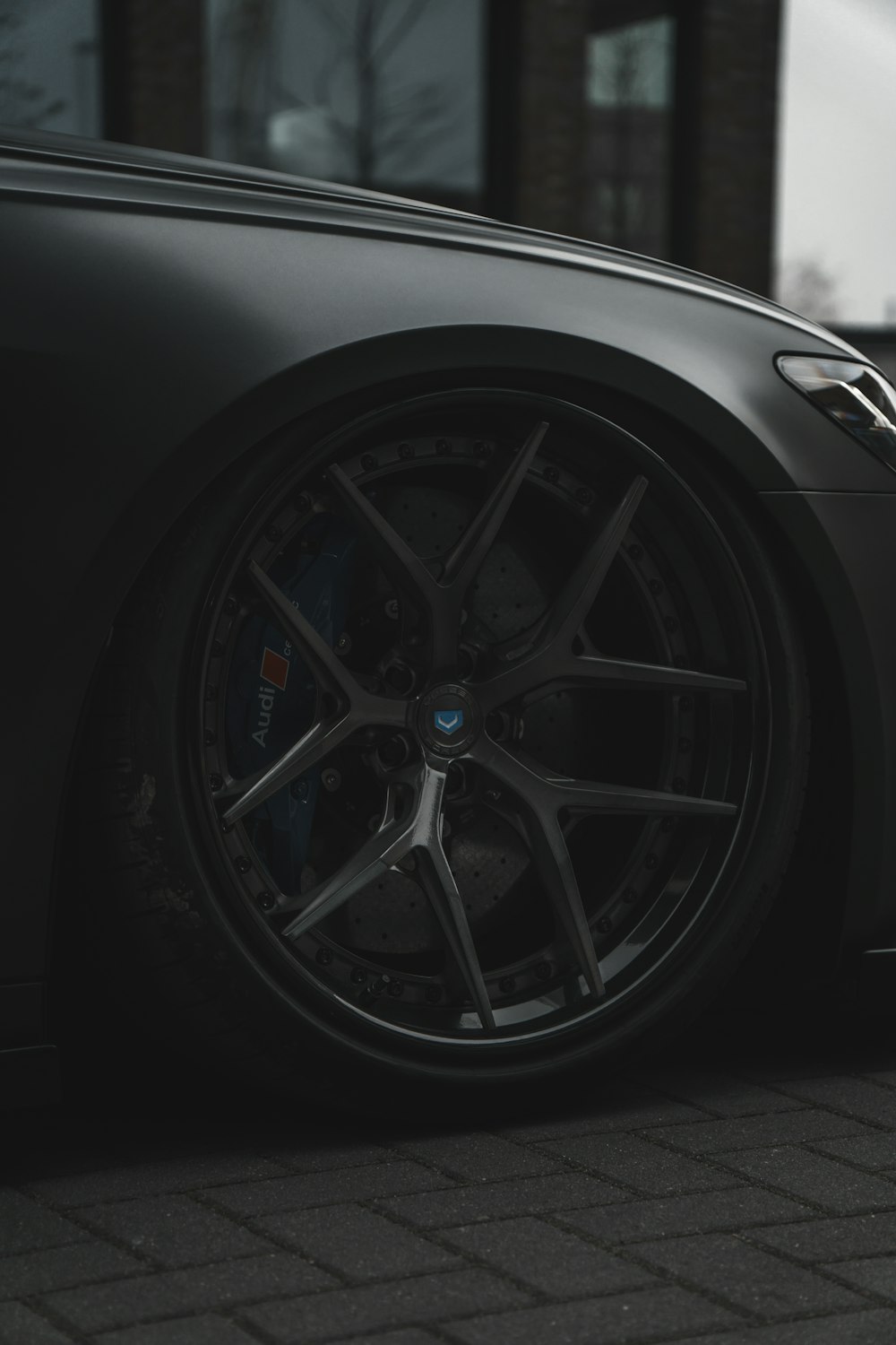 a close up of a car tire on a street