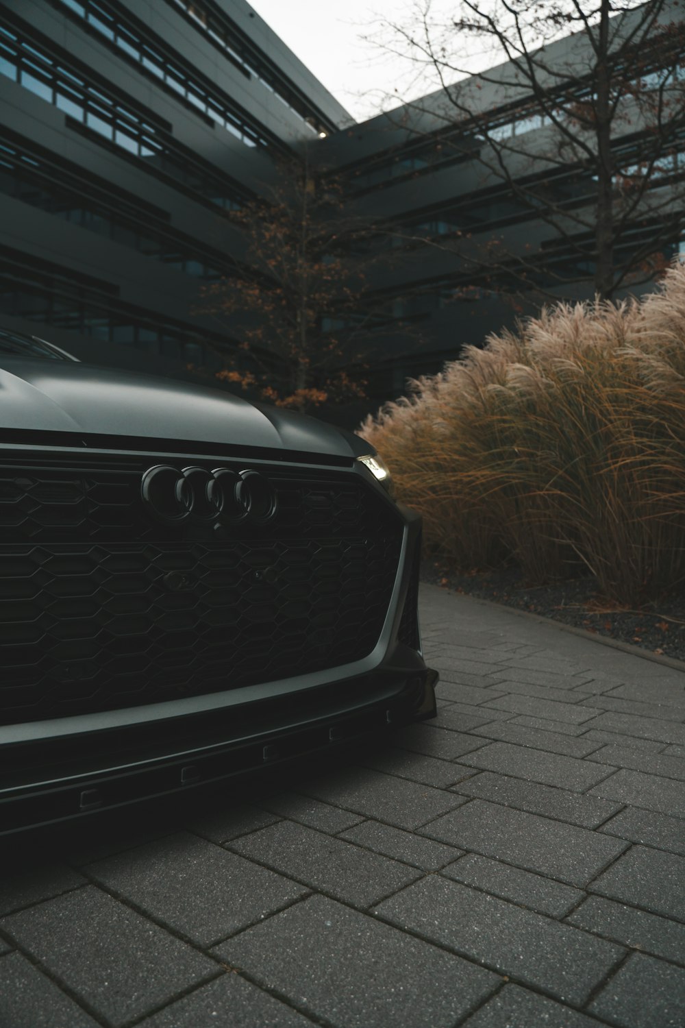 a black car parked in front of a building