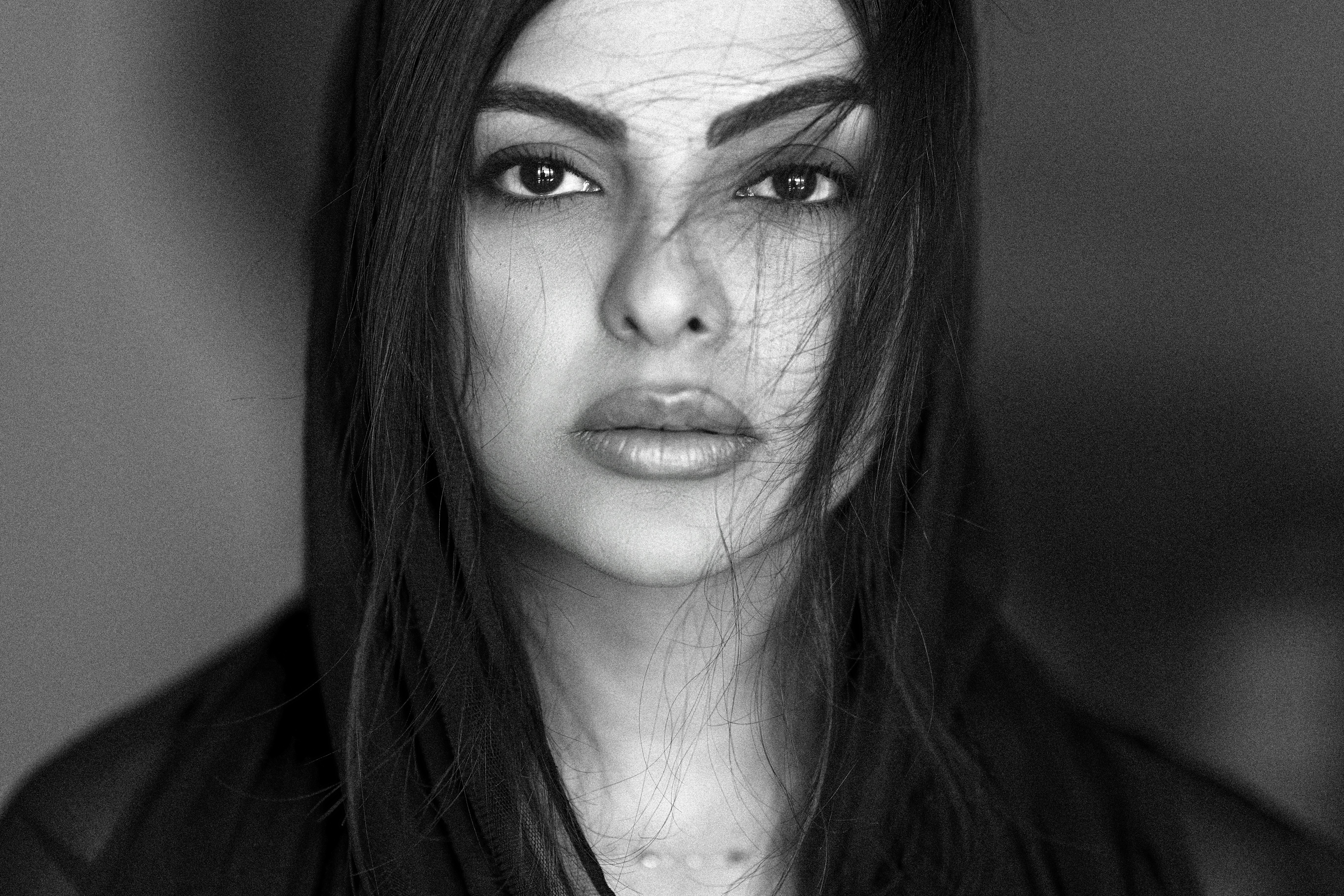 A black and white photo of a woman with long hair photo – Free Woman ...