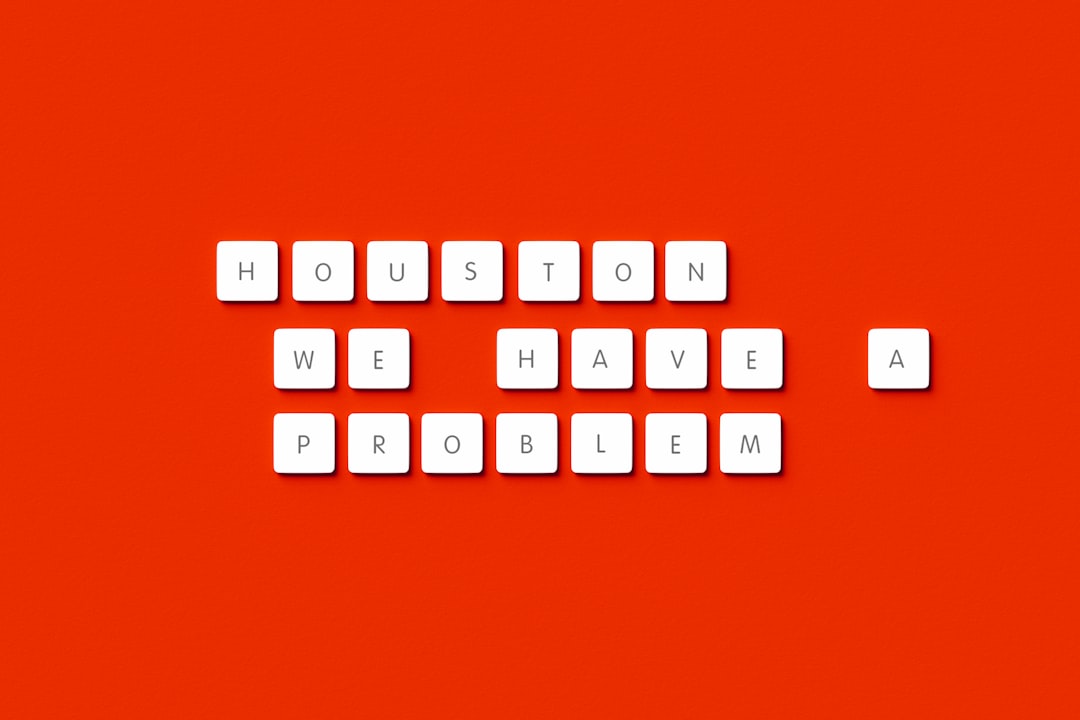 the words houston, we have problem written on a red background, Houston We Have A Problem! "Houston we have a problem" phrase made out of computer keys on orange background. Famous movie quote.
