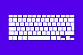 A white computer keyboard is arranged in a straight, organized format against a vibrant purple background. The keys are clearly labeled with numbers, letters, and symbols, providing a clean and modern aesthetic.
