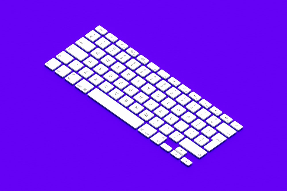 a computer keyboard on a purple background
