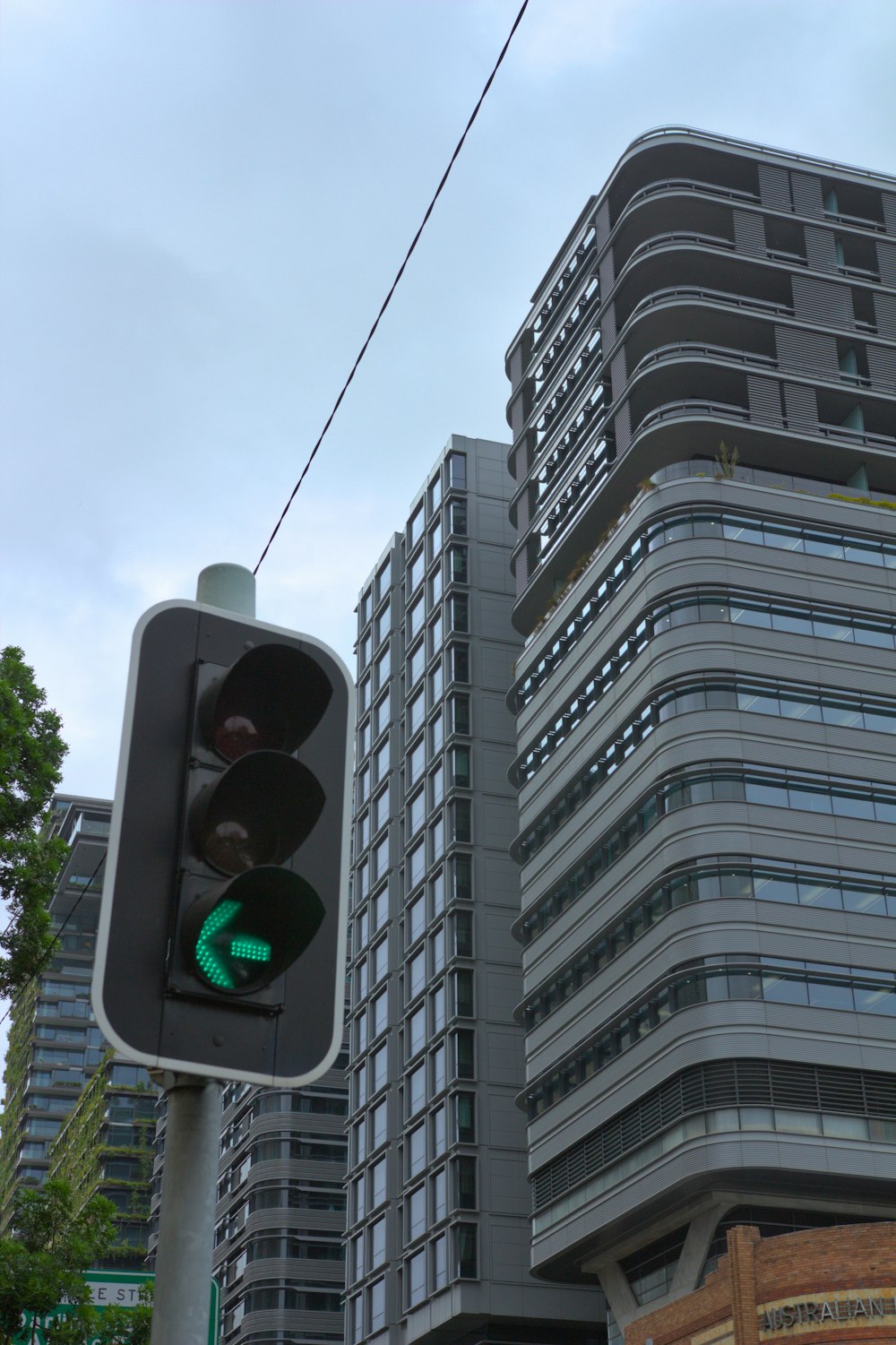 a traffic light with a building in the background