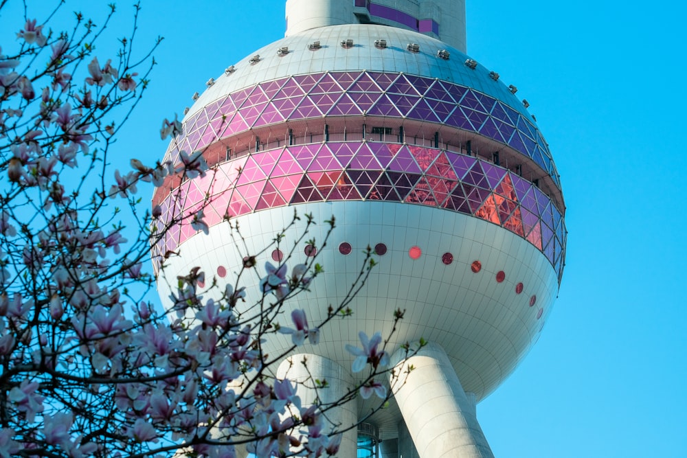 a very tall building with a very colorful top