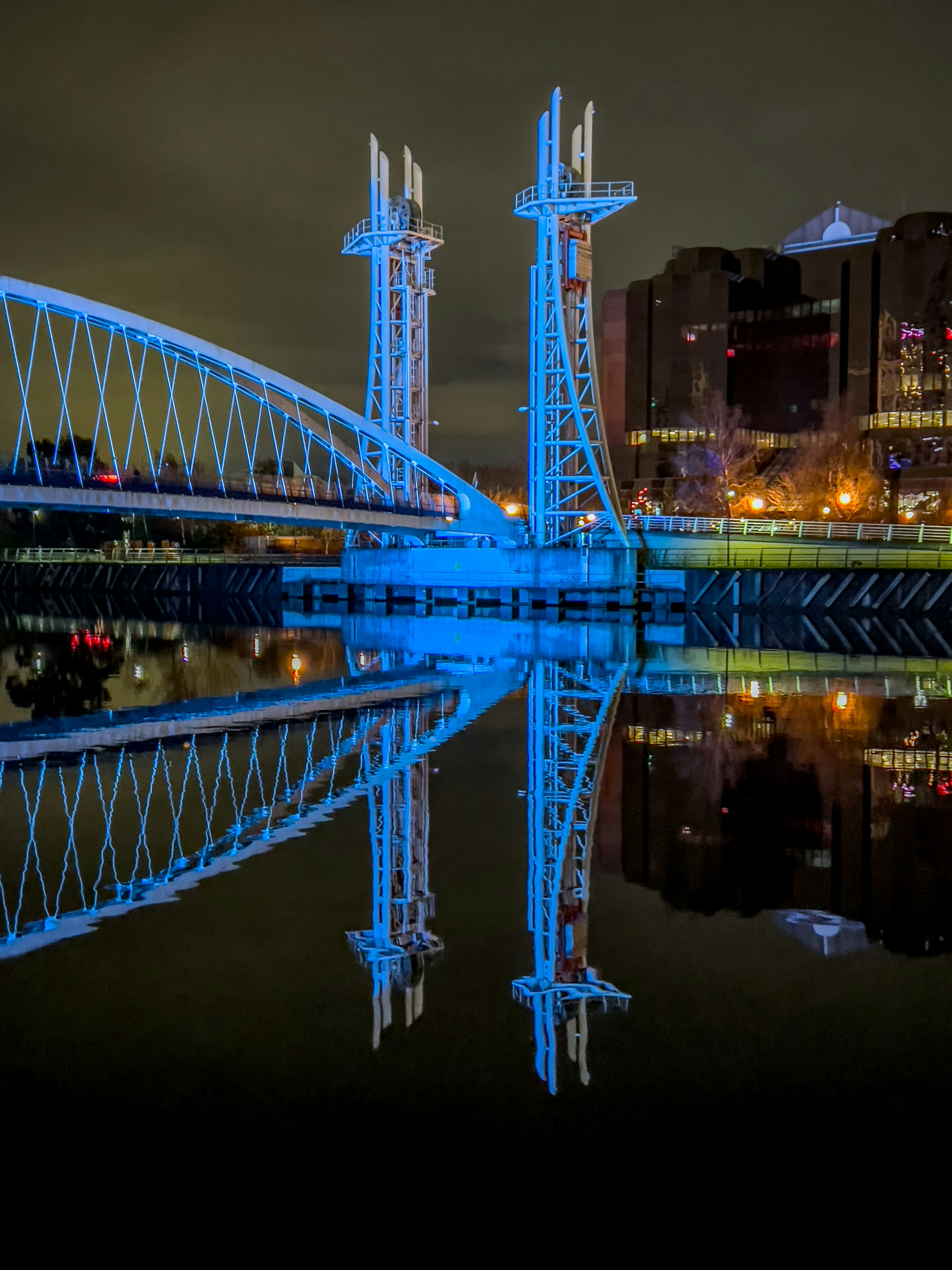 A large bridge over a body of water at night photo – Free Salford Image ...
