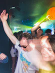 a group of people dancing at a party