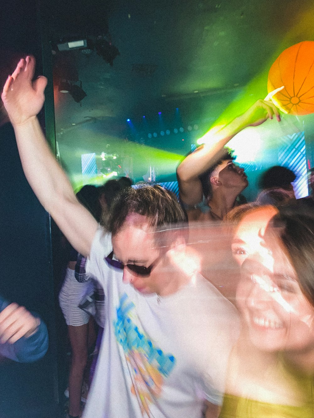 a group of people dancing at a party