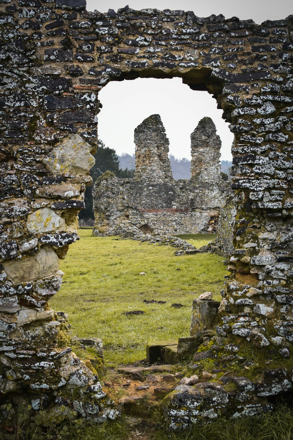 a stone wall with a hole in the middle of it