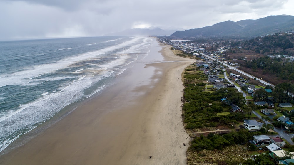 an aerial view of a beach and a town