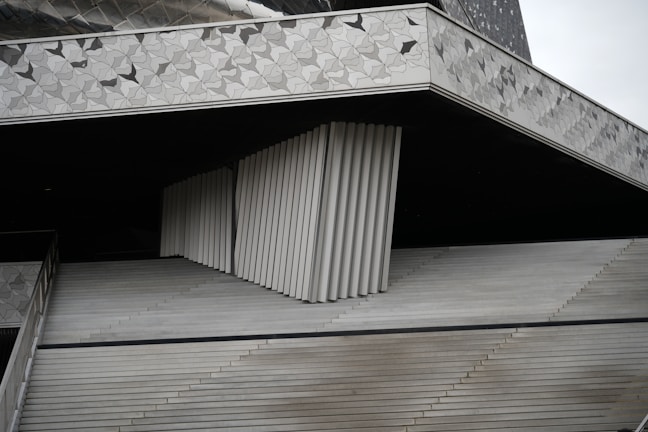 Conceptual architectural visualization blending neutral shades with geometric forms.