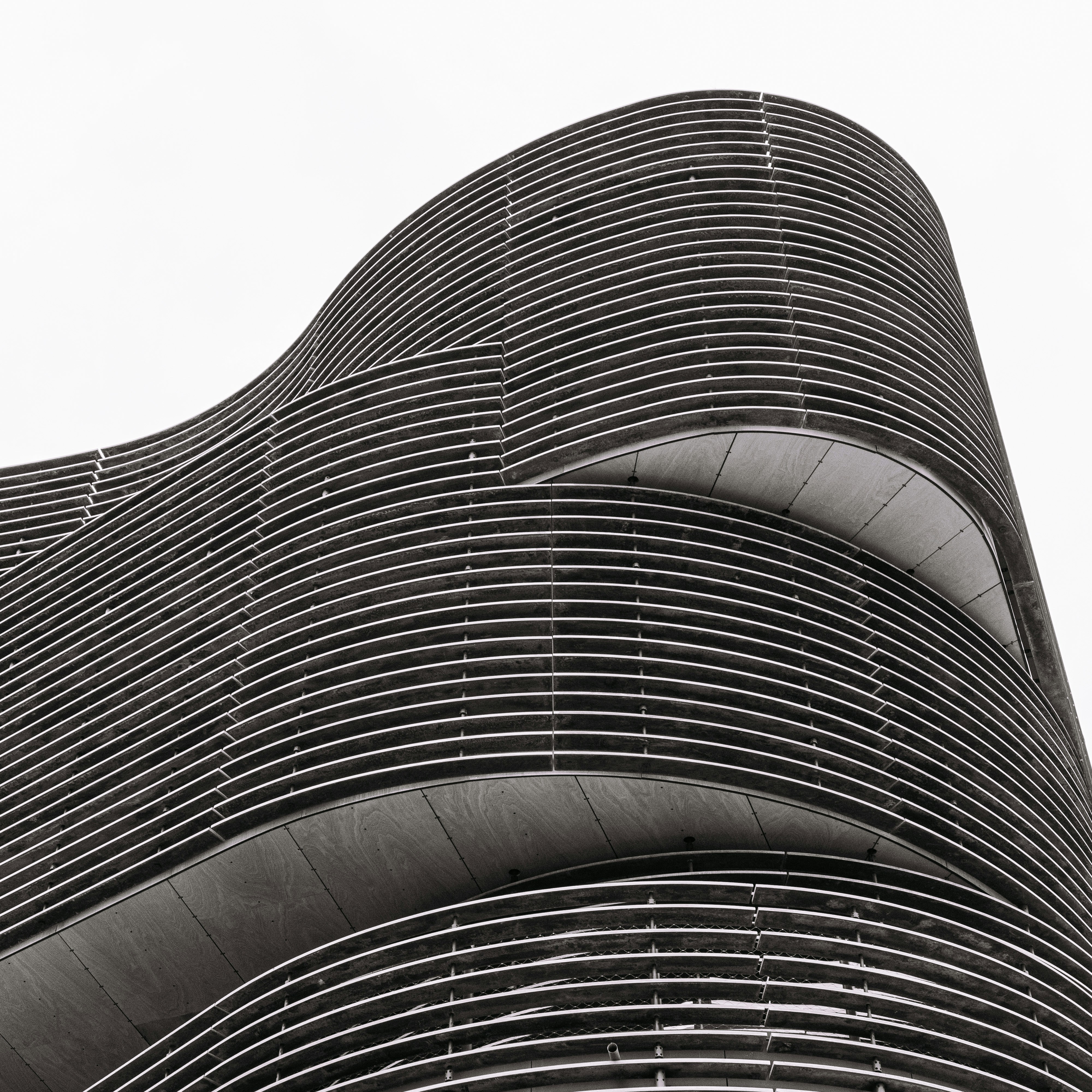 a black and white photo of a very tall building