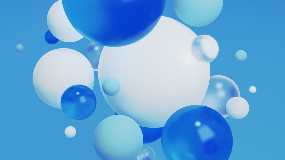 Un montón de globos azules y blancos flotando en el aire