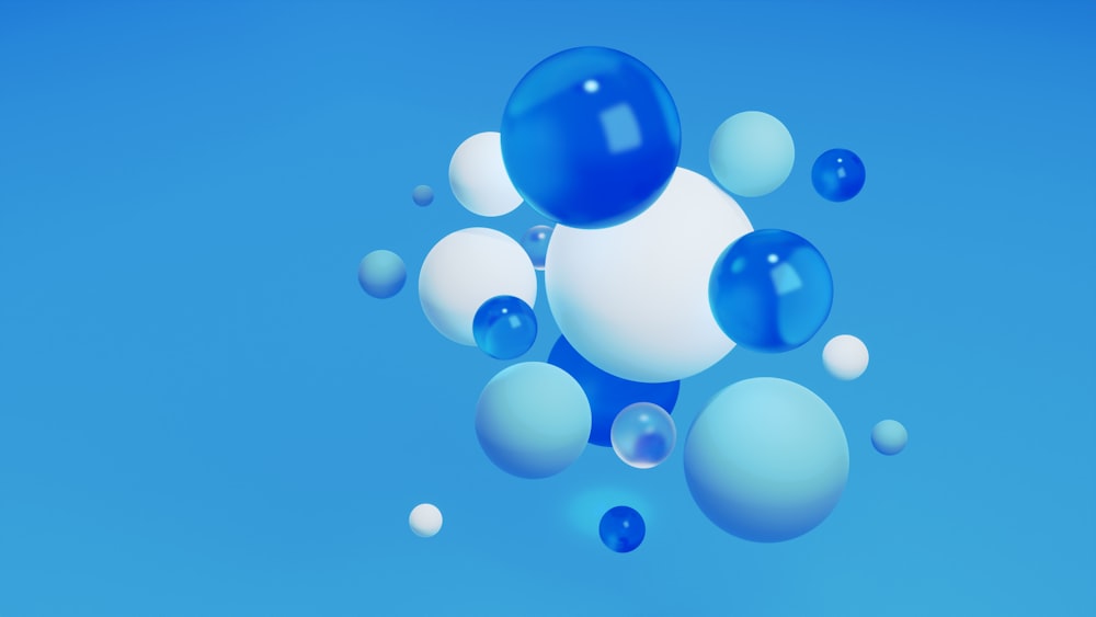 a group of blue and white balls floating in the air
