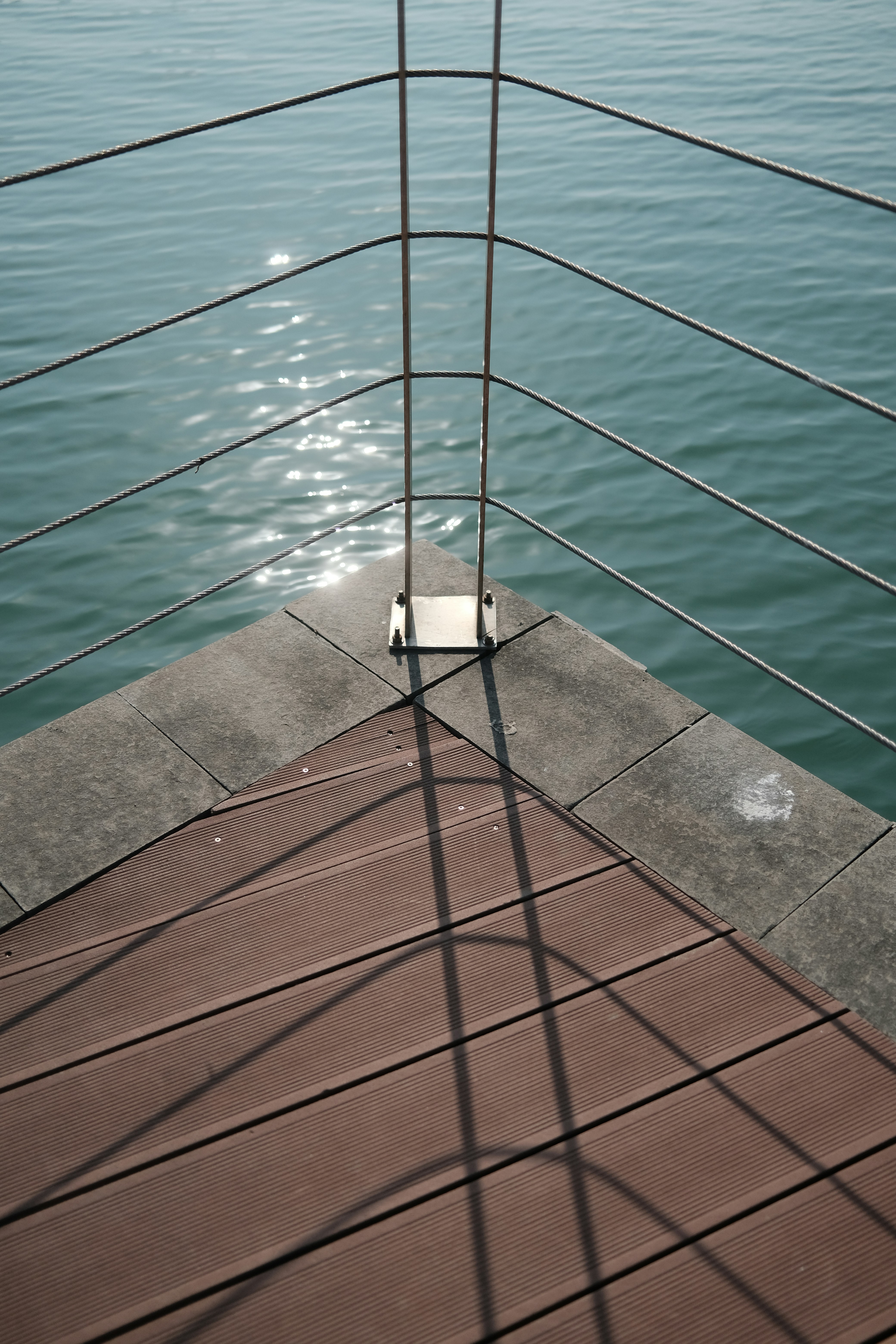 a white object sitting on top of a wooden dock