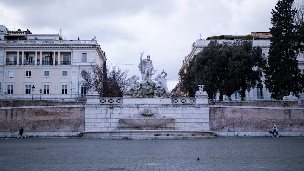 a large building with a fountain in front of it