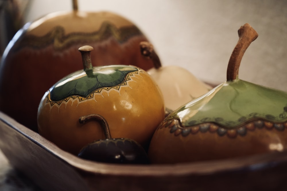 a close up of a bowl of fruit on a table