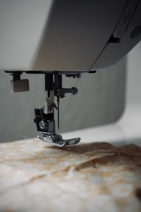 a close up of a sewing machine on a table