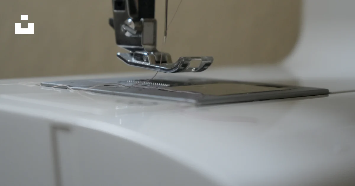 Sewing Machine Tablet A close up of a sewing machine with a tablet on it photo – Free Sewing ...