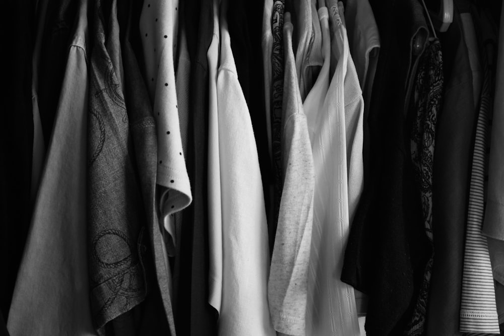 a bunch of clothes hanging on a rack