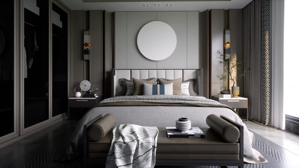 a bedroom with a large bed and a round mirror on the wall