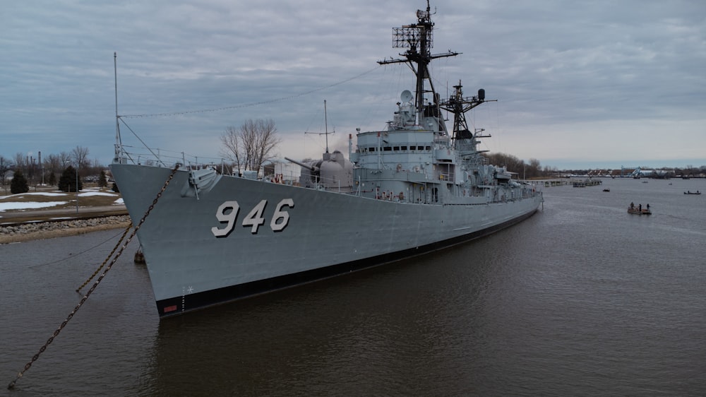 a large battleship sitting on top of a body of water