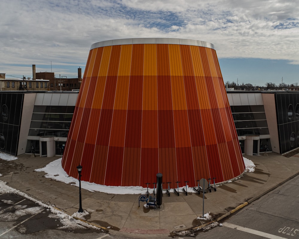 a large orange building with a sky background