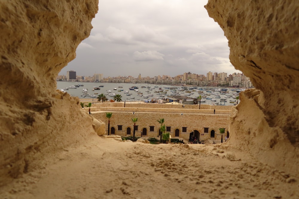 a view of a harbor from inside a cave