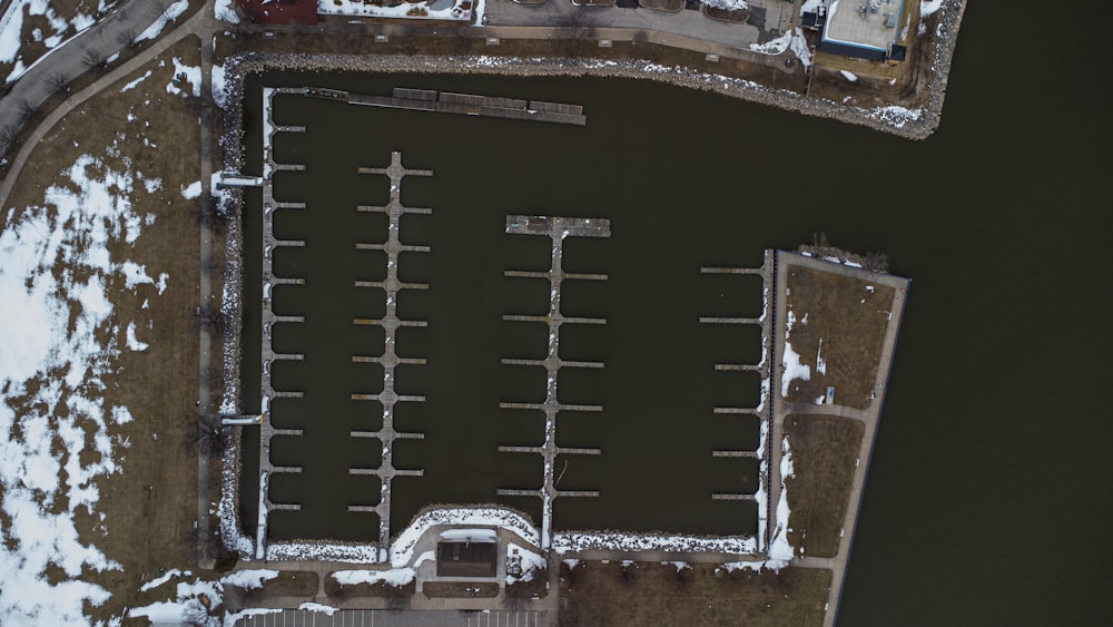 an aerial view of a parking lot in the snow
