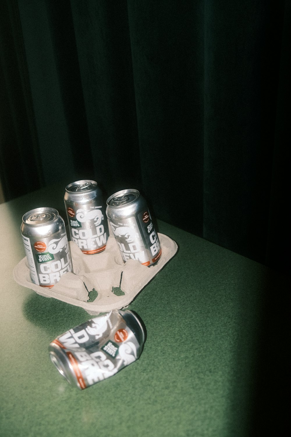 a group of cans of beer sitting on top of a counter
