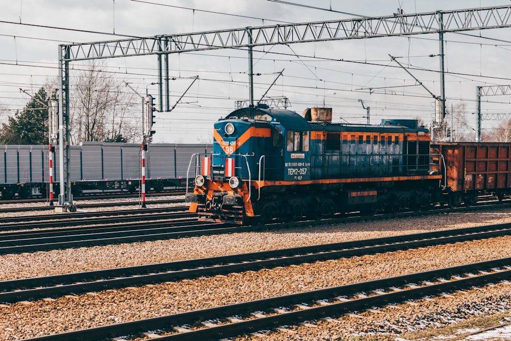 a train engine carrying carts down a track