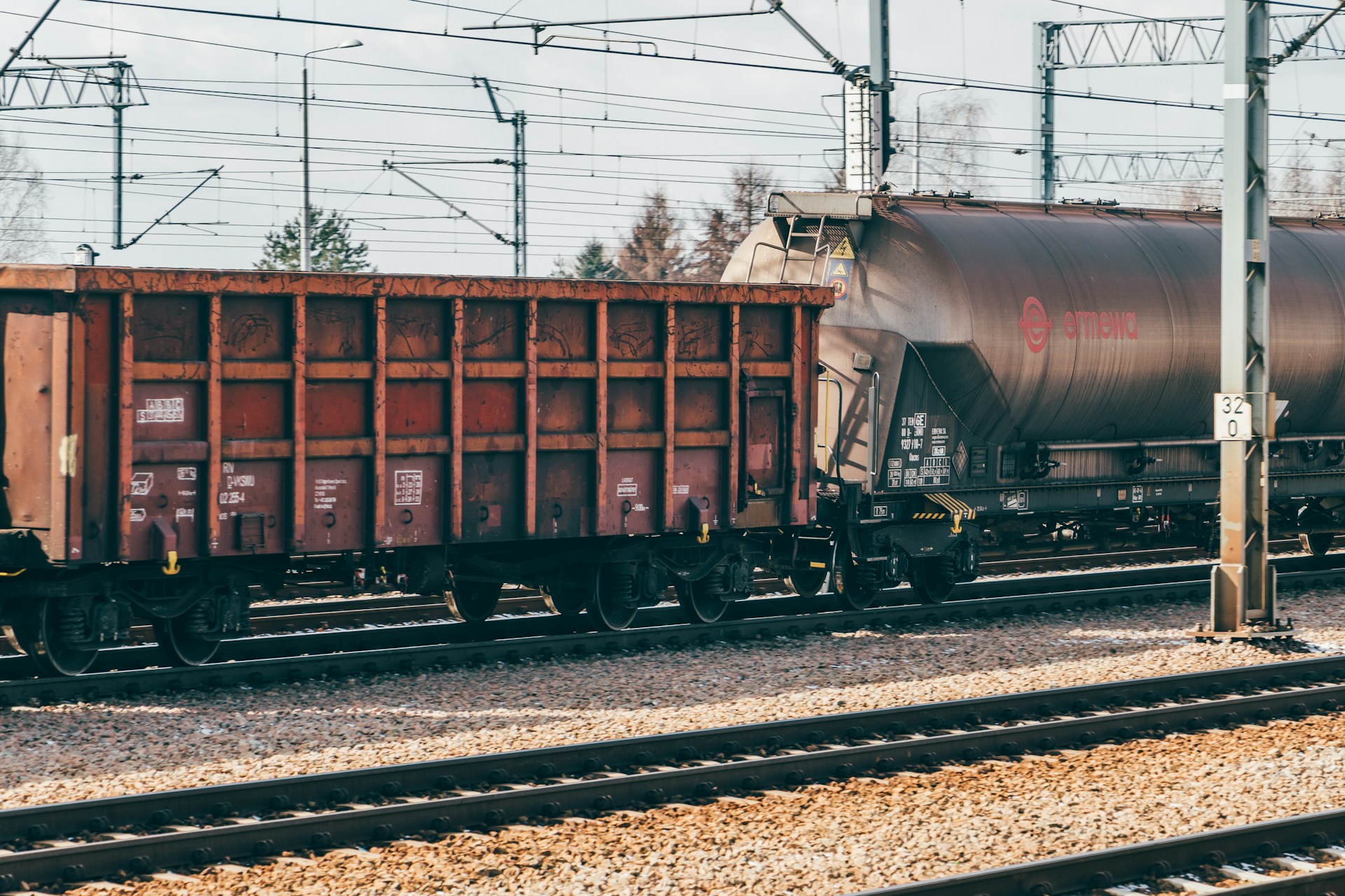 a train on a train track with a sky background