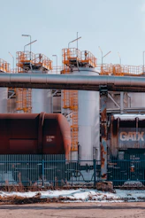 a train on a train track next to a building