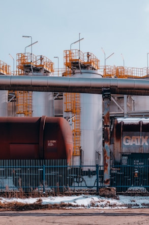 a train on a train track next to a building
