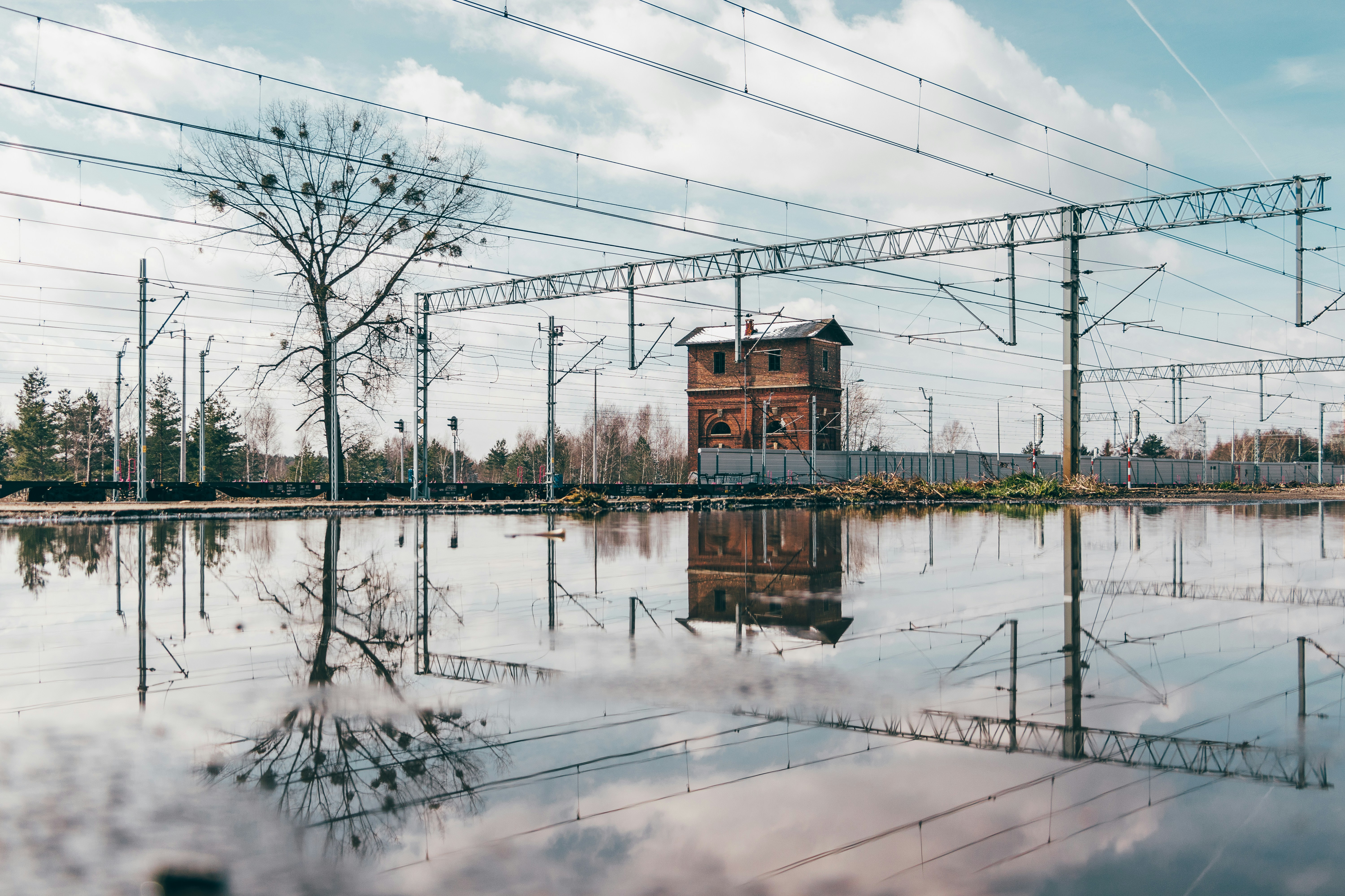 a building sitting in the middle of a flooded area