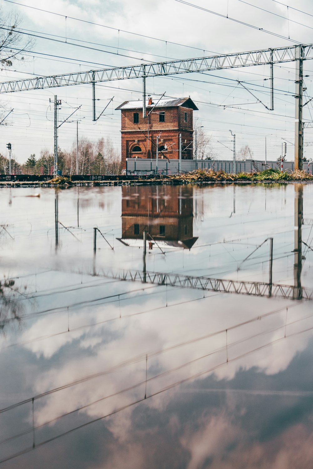 a building sitting in the middle of a flooded area